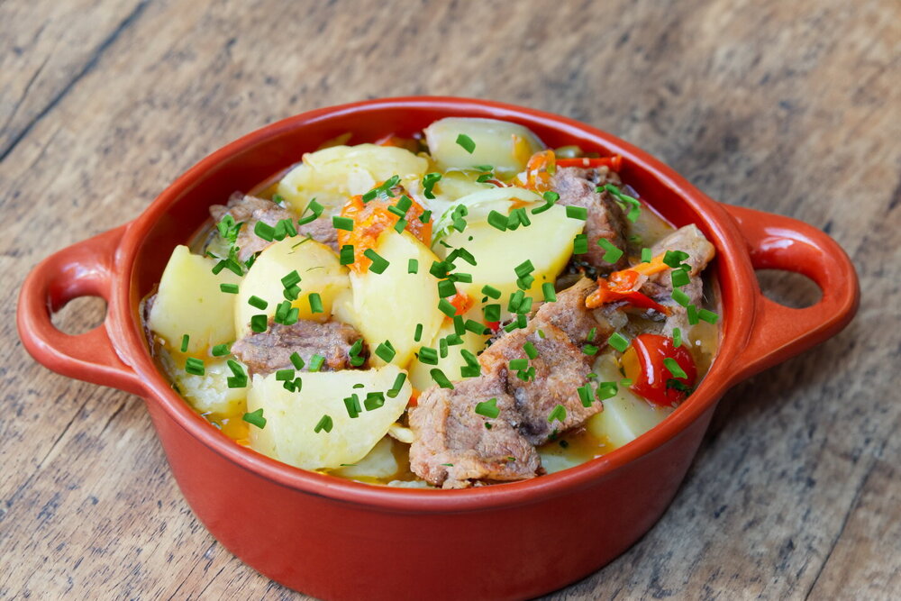 Stewed Beef with Potatoes in a Cauldron over Campfire