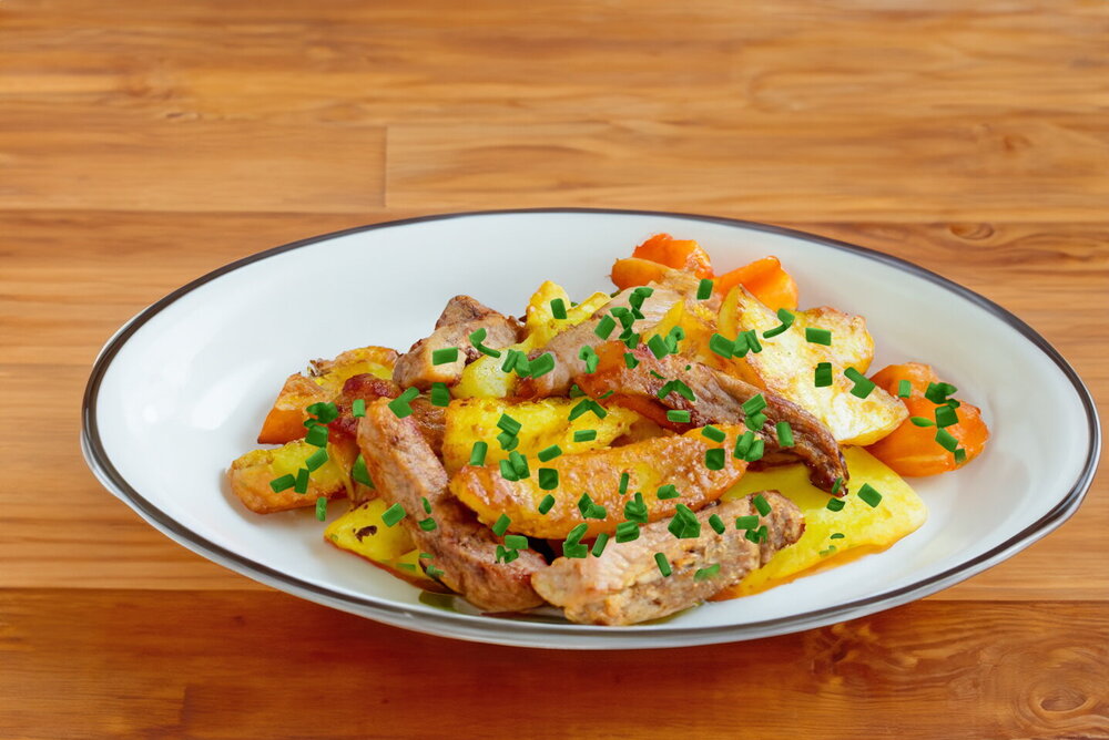 Fried Potatoes with Meat in a Skillet