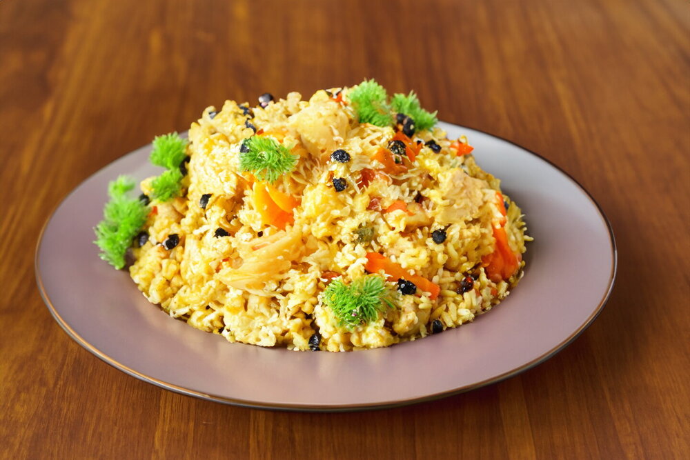 Chicken Pilaf in a Cauldron on the Stove
