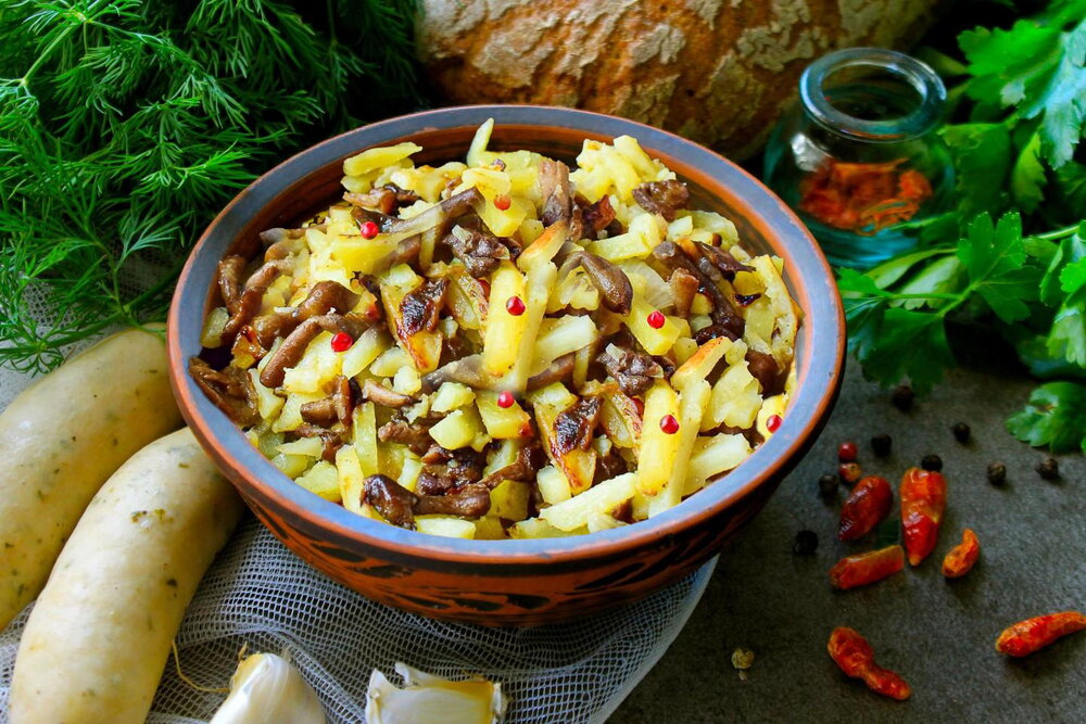 Fried Potatoes with Honey Mushrooms in a Skillet