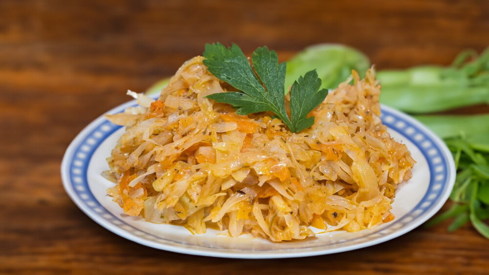 Cabbage with Carrots and Onions in a Skillet