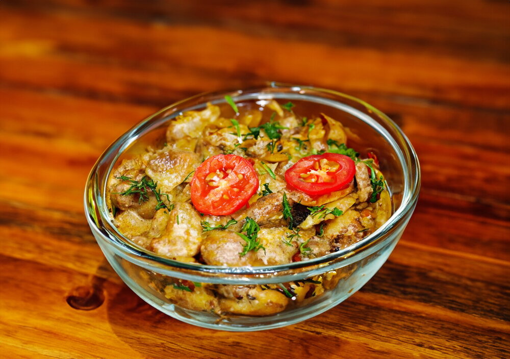 Chicken Hearts and Liver in Sour Cream in a Skillet