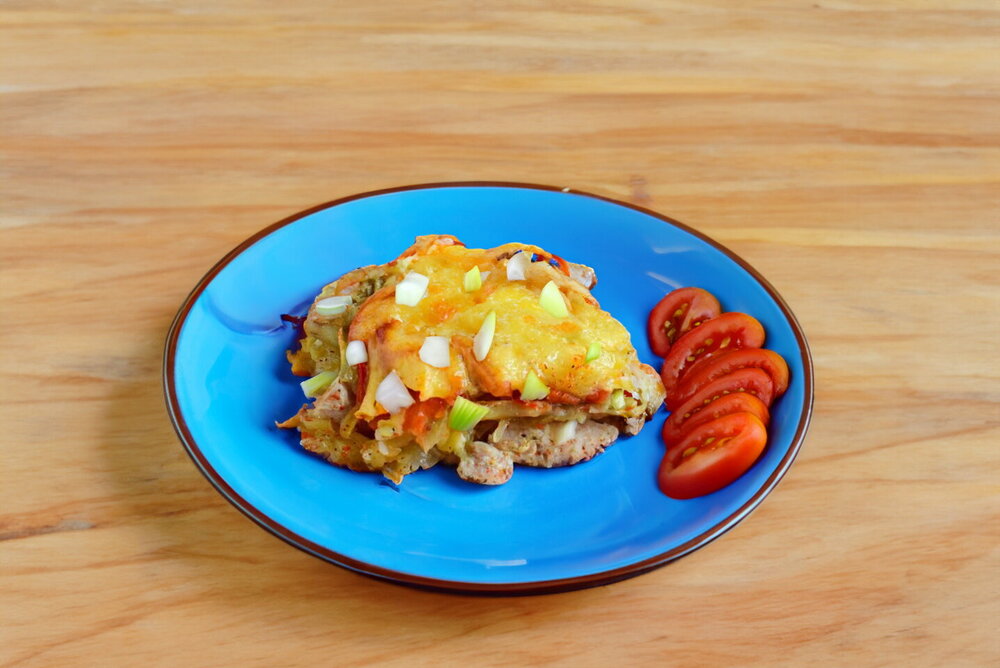 Oven-Baked Pork under Potato and Cheese Crust