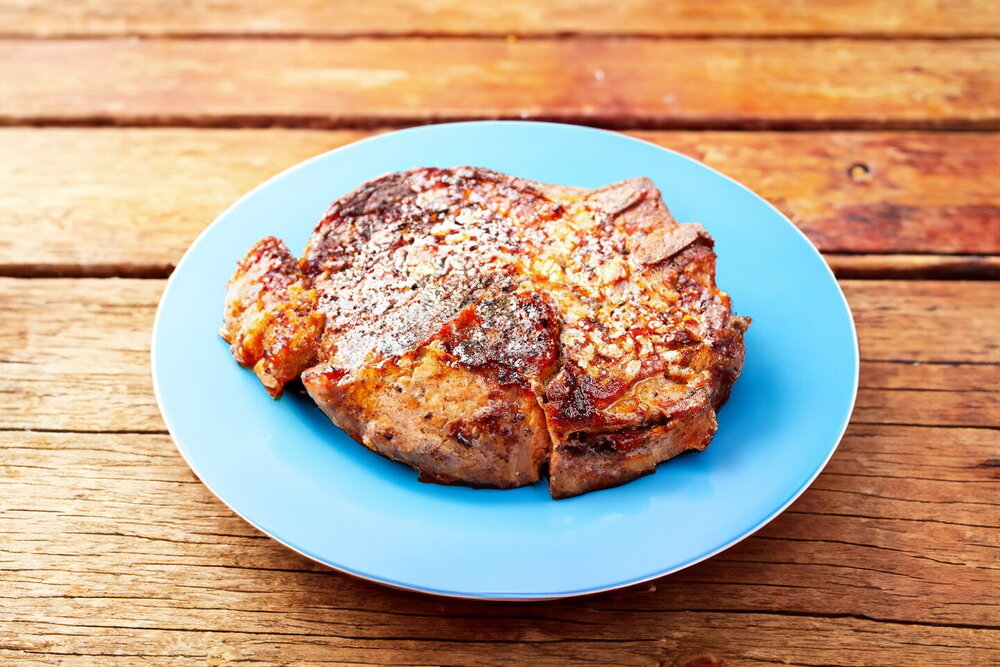 Grilled Bone-In Pork Steaks on a Charcoal Brazier