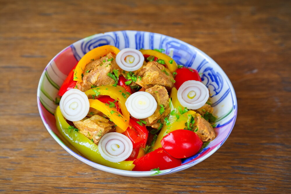 Pork with Bell Peppers in a Skillet