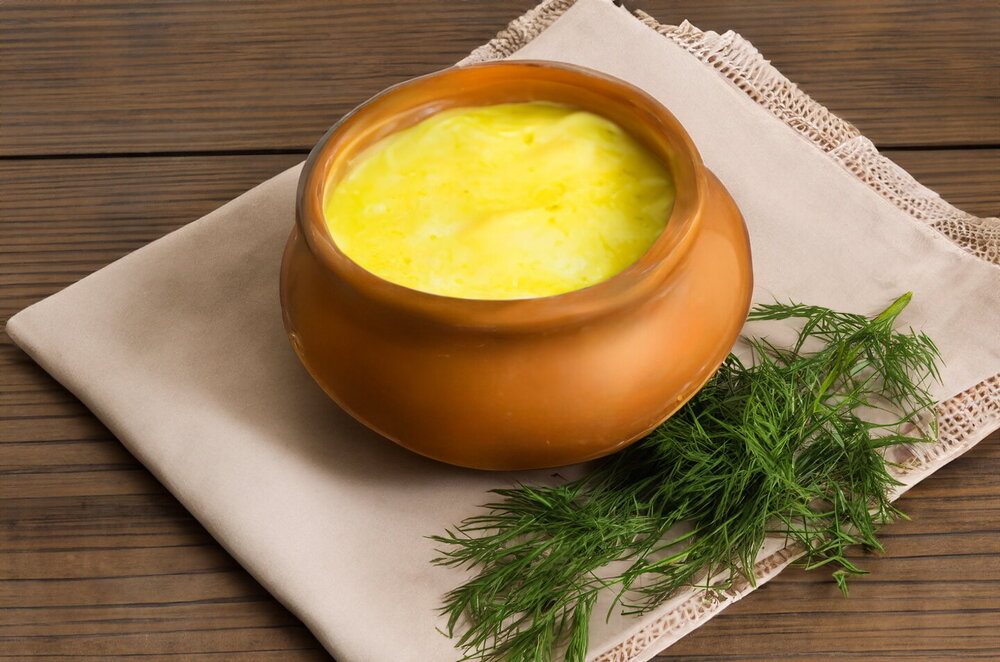 Mushrooms in Sour Cream in a Pot with Cheese