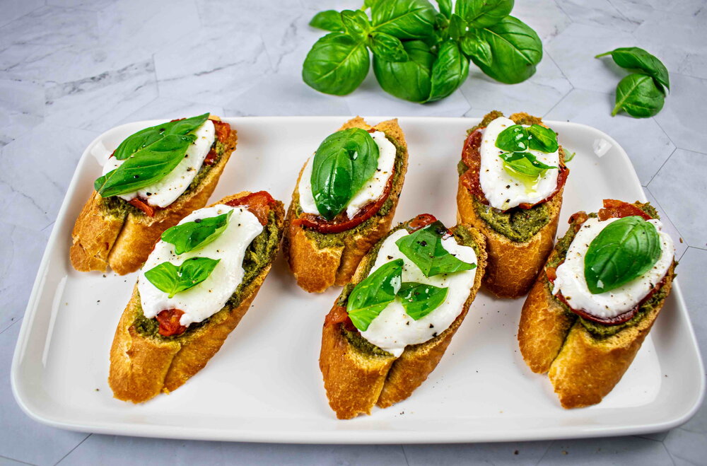 Bruschetta with pesto, tomatoes and mozzarella 