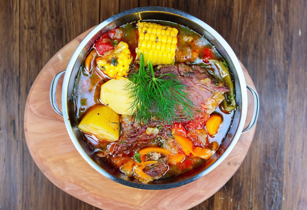 Beef Shurpa in a Cauldron over a Campfire