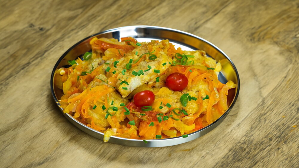 Fried Pollock with Vegetables in a Skillet