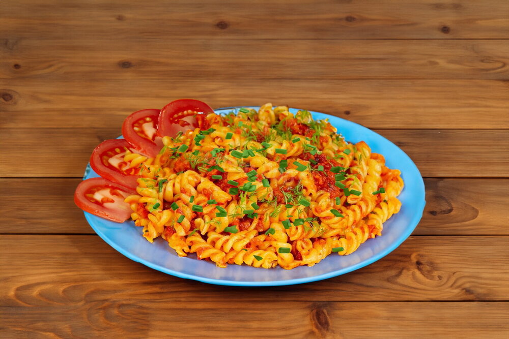 Navy-style pasta in a skillet with canned meat