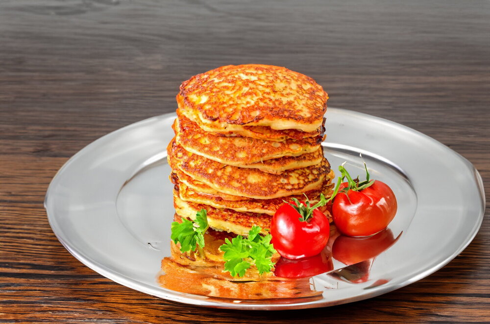 Potato Pancakes (Draniki) in a Skillet with Egg