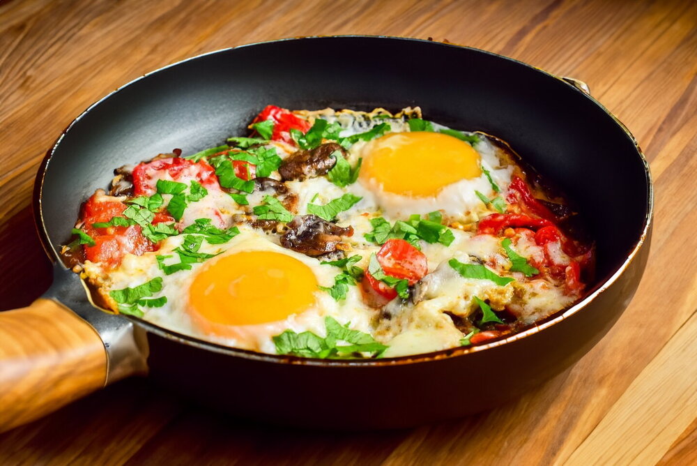 Fried Eggs with Mushrooms, Tomatoes, and Cheese