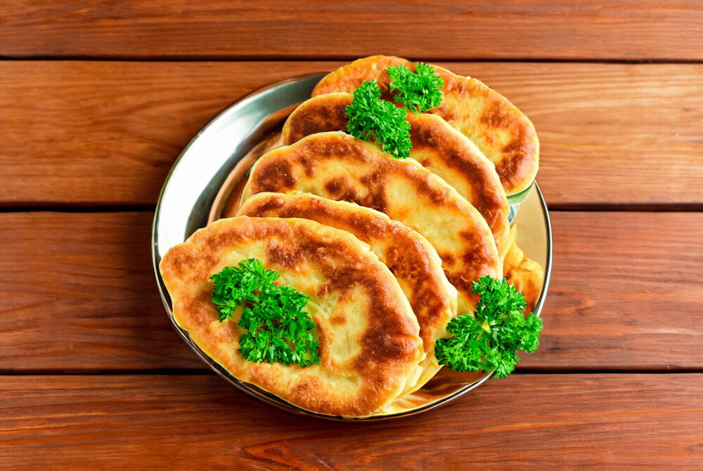 Thin Fried Pies with Potatoes in a Pan