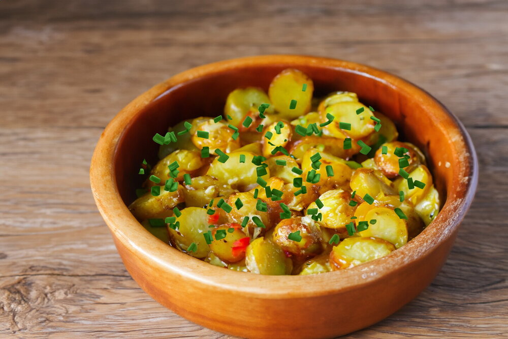 Fried Potatoes with Cheese in a Skillet