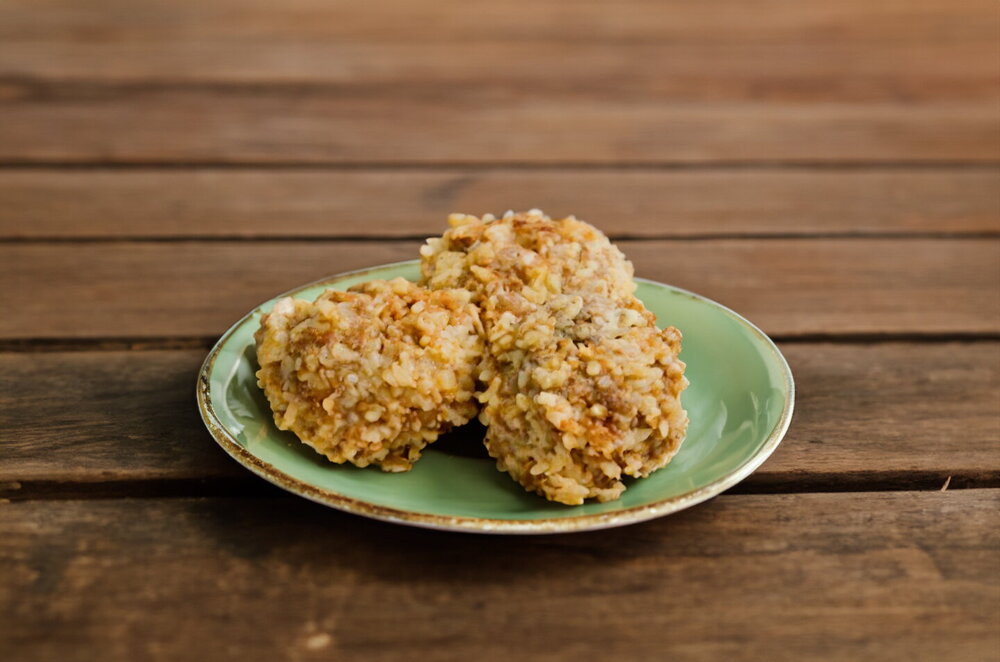 Meat “Hedgehogs” on an Onion Bed in a Skillet