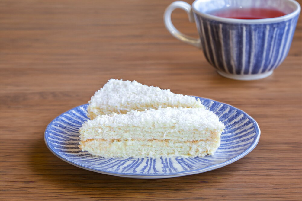 Cake with Cream-Cheese Frosting and Coconut Flakes