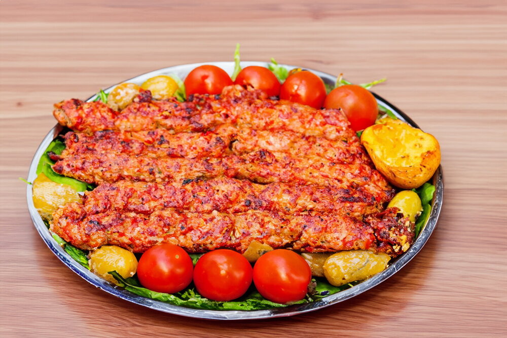 Lula Kebab on Skewers over a Charcoal Grill