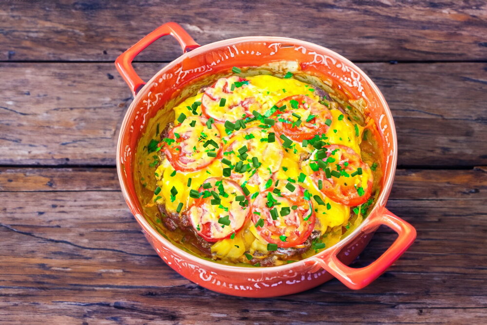 Oven-Baked Beef with Potatoes, Tomatoes, and Cheese