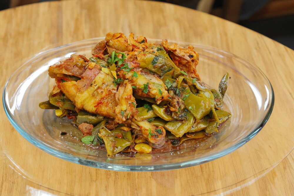 Green Beans with Chicken in a Cauldron over an Open Fire