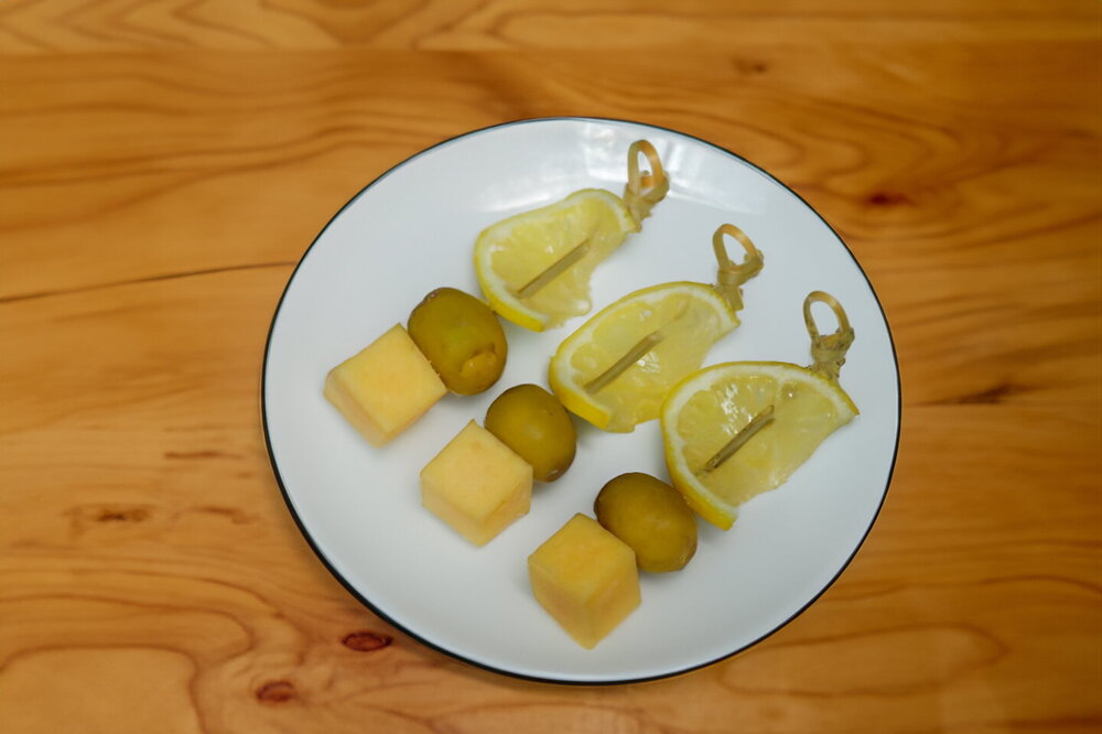 Canapés with Black Olives and Cheese on Skewers