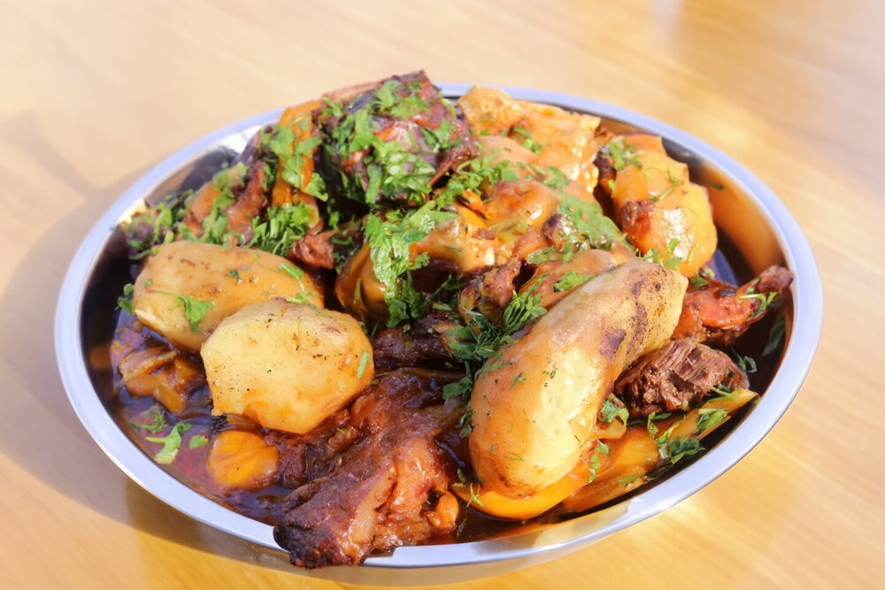 Uzbek Layered Lamb and Vegetable Stew in a Cauldron