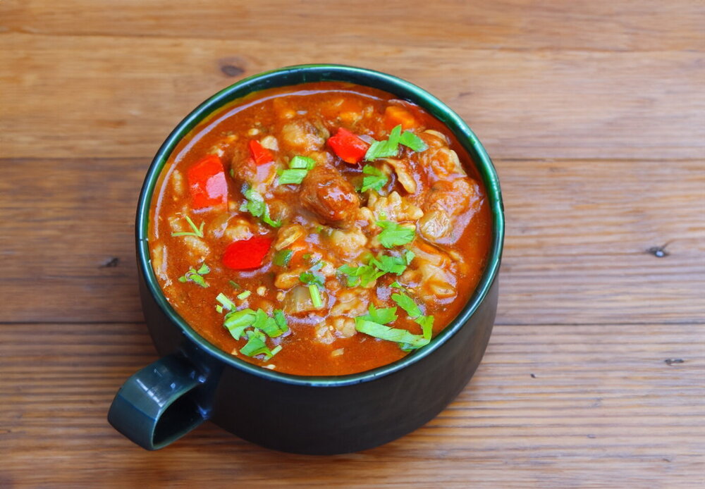 Kharcho Soup in a Cauldron over a Fire