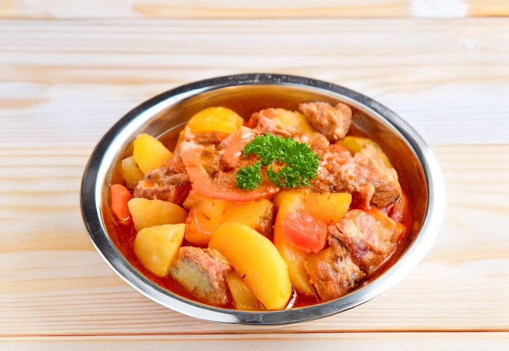 Stewed Potatoes with Meat in a Cauldron