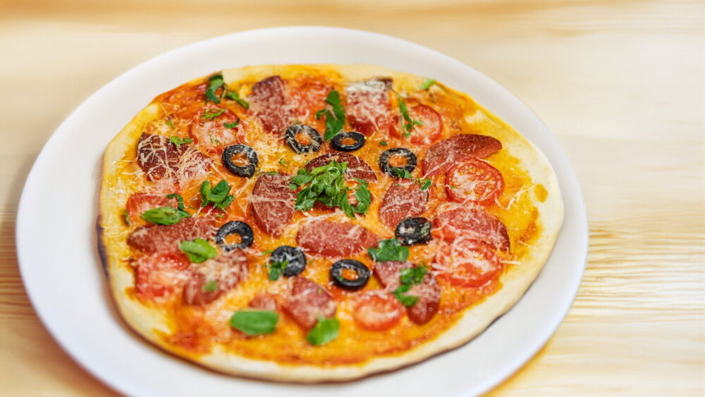 Mini Pizza with Salami, Tomatoes and Cheese