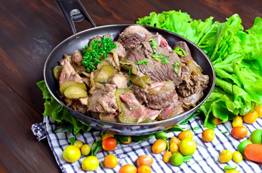 Chicken Liver with Pickled Cucumbers in a Skillet