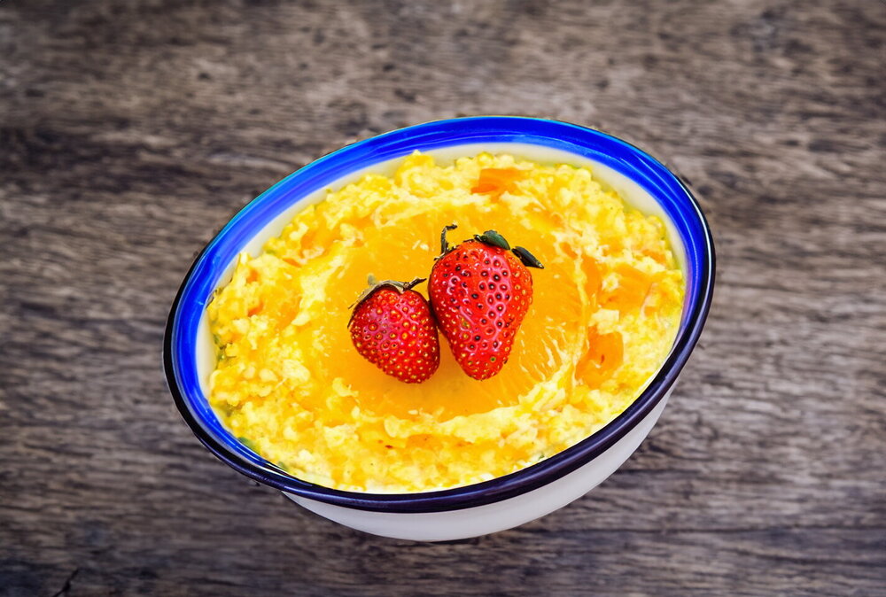 Millet Porridge with Pumpkin Cooked in a Pot on the Stove
