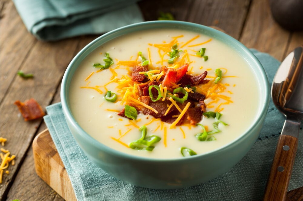 Potato soup with crispy potato skin topping