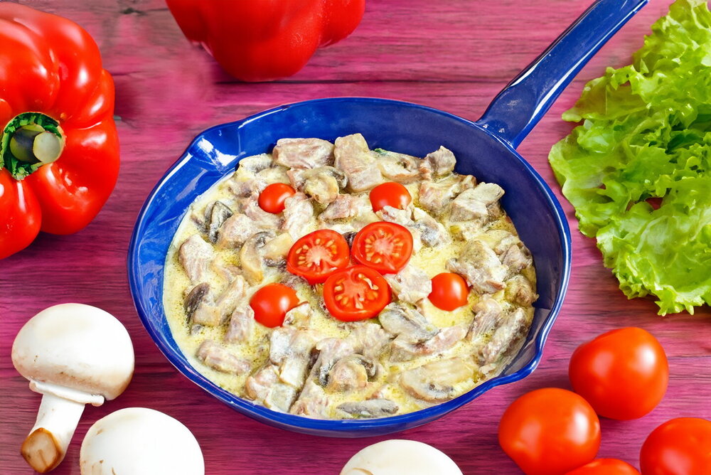 Turkey with Mushrooms in Cream Sauce on the Pan