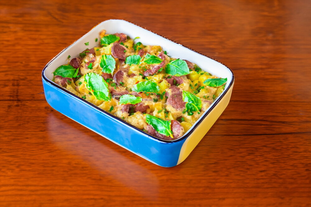 Sausages Baked in the Oven with Potatoes and Cheese
