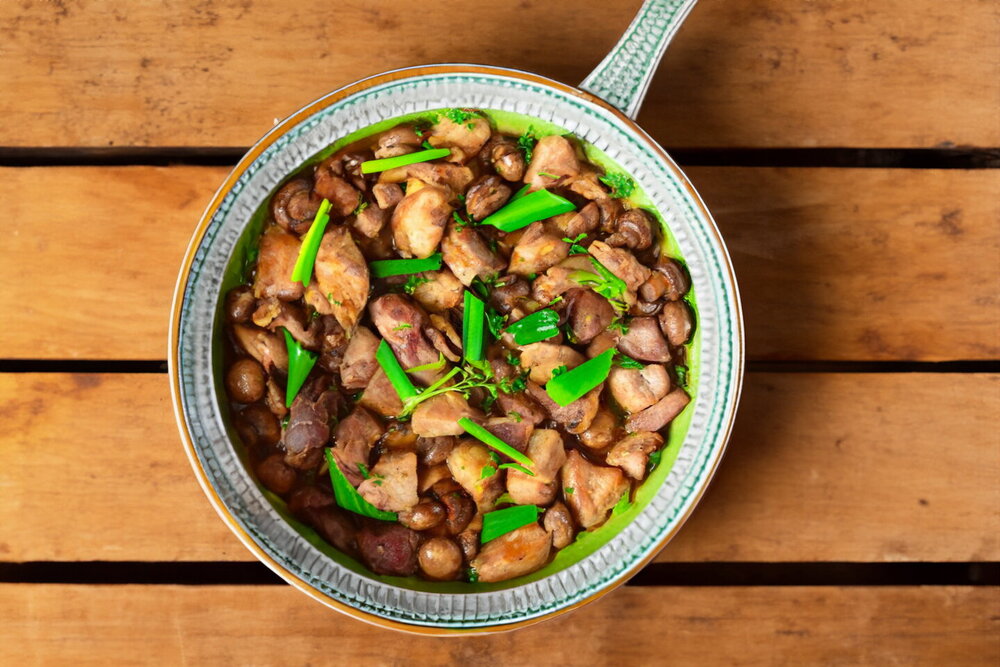 Stewed Meat with Mushrooms in a Skillet